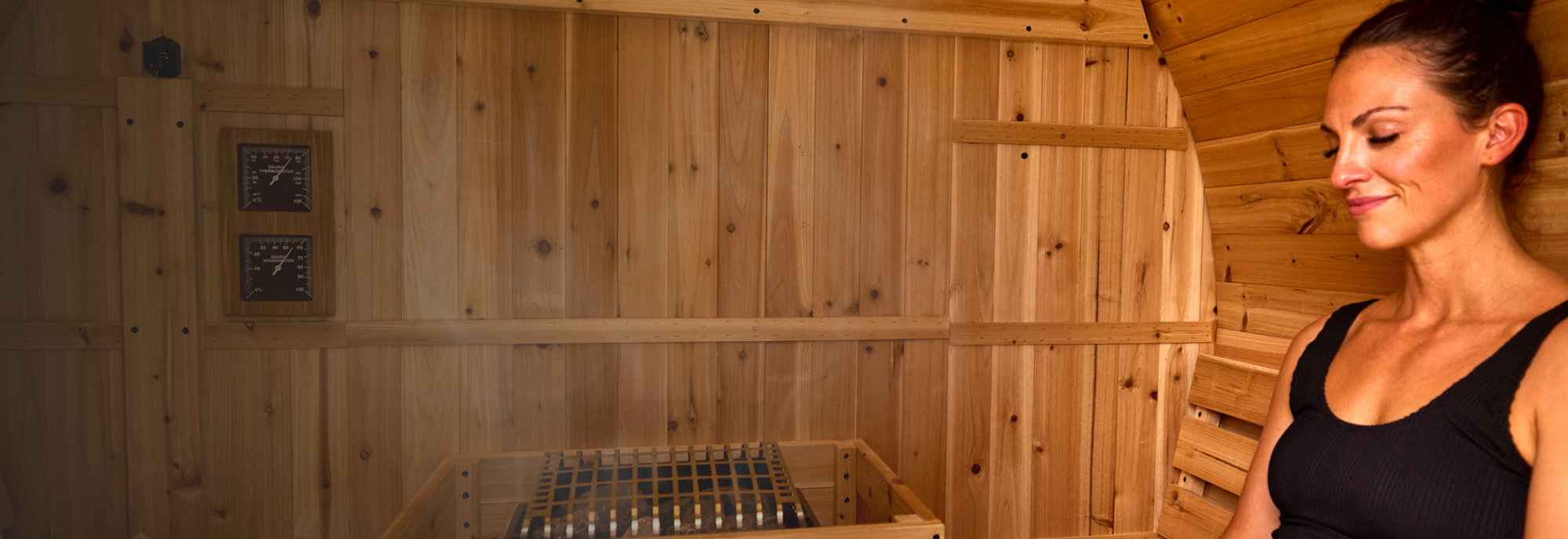 Woman standing in a wooden sauna