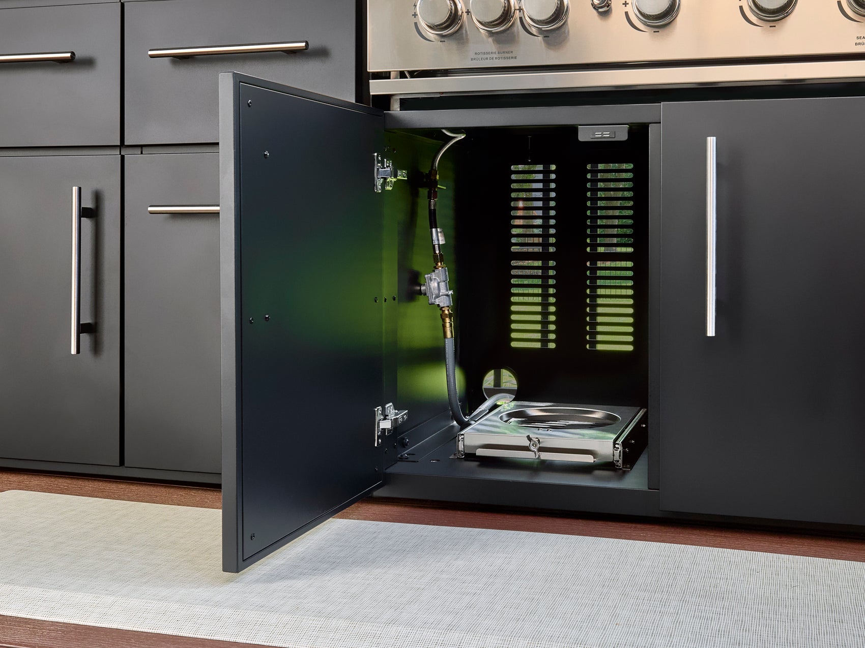 Gas grill connection and pull-out propane drawer inside Range Outdoor Living Lancaster Linear kitchen cabinet.