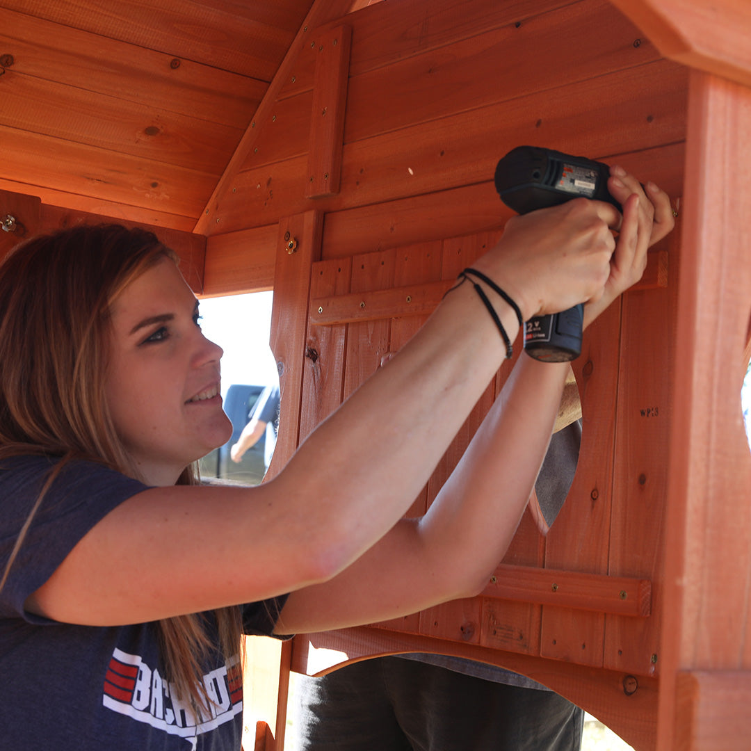drilling a swing set together