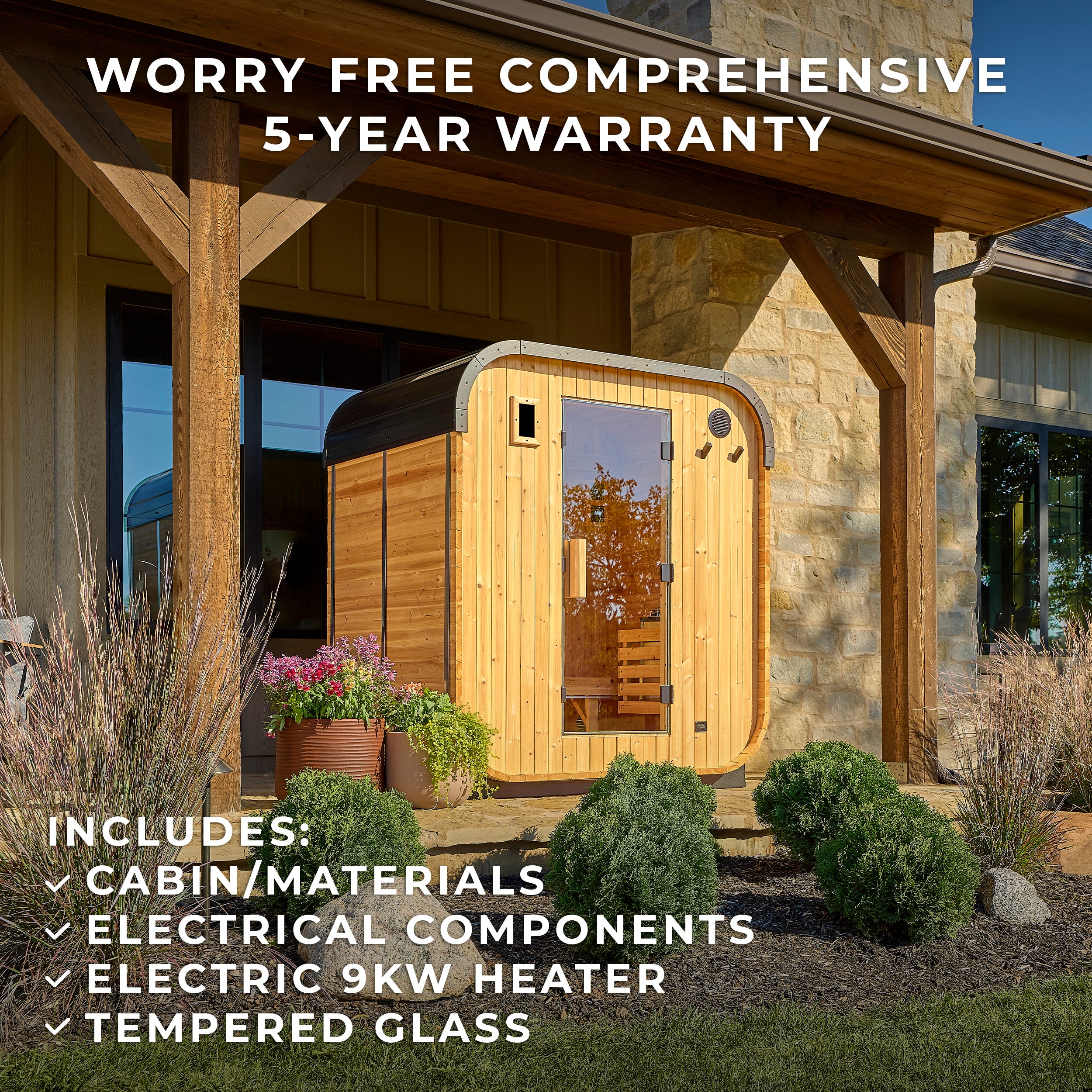 Lennon 2-4 person outdoor home sauna installed under covered patio next to stone home with garden beds