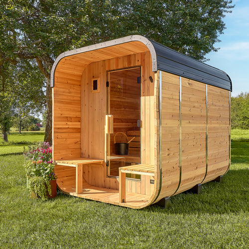 Backyard Discovery Lennon 4-6 person outdoor cube cedar sauna with porch and steel roof in sunny backyard