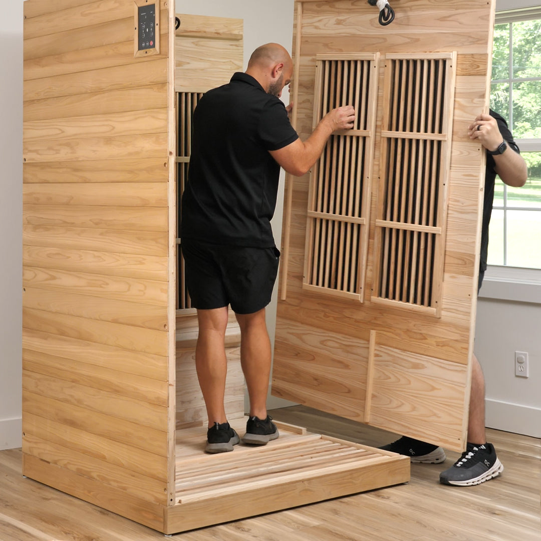 DIY assembly of Rylan indoor infrared cedar sauna kit installing pre-built wall panels for home gym