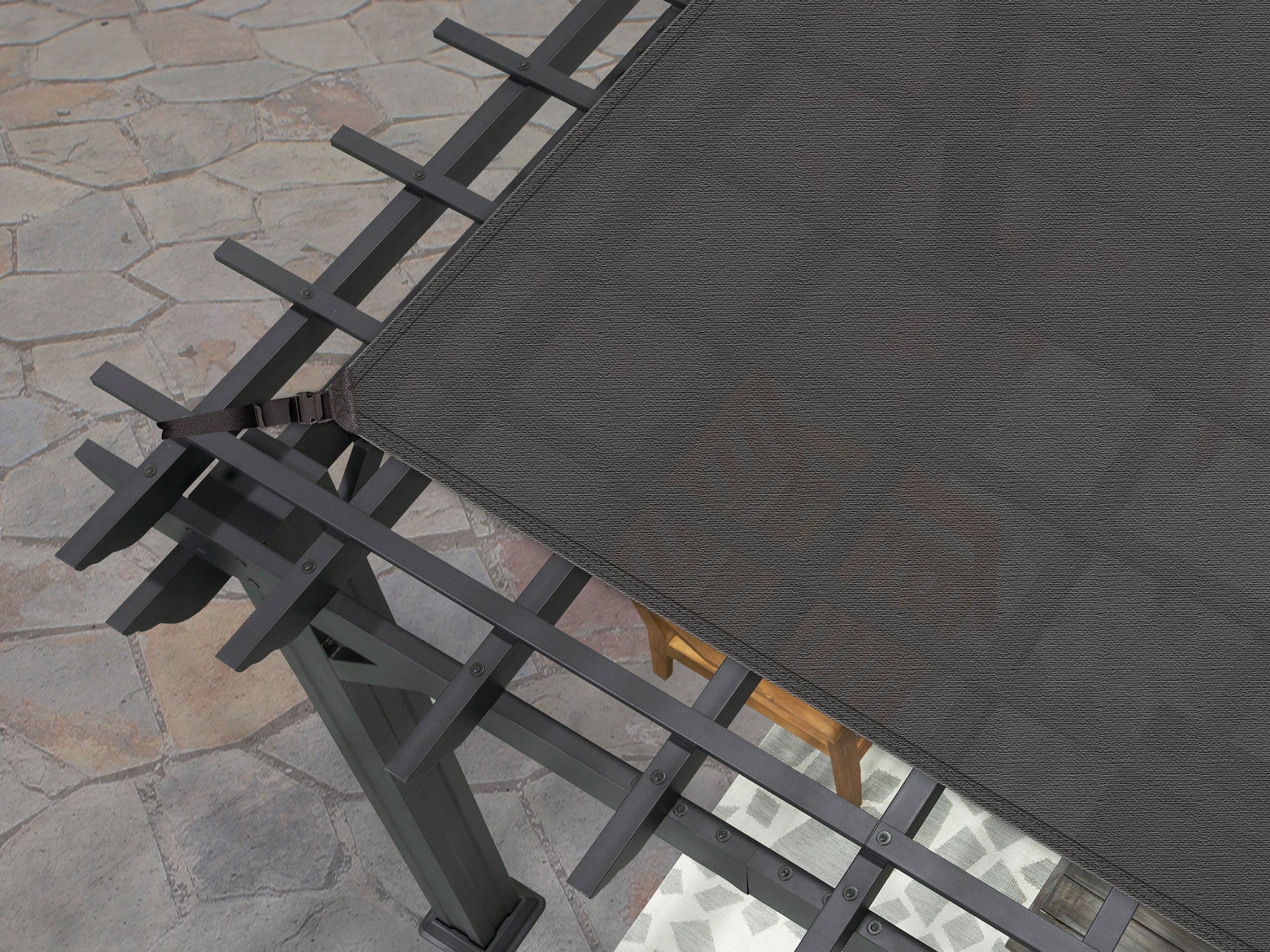 Range Outdoor Living Stratford metal pergola with trellis roof and fabric shade canopy on patio.