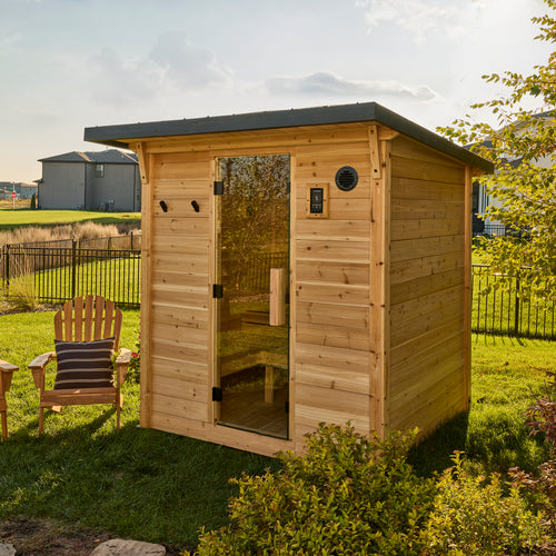 Backyard Discovery Henley 4-6 person outdoor cabin cedar sauna with glass door and steel roof in backyard