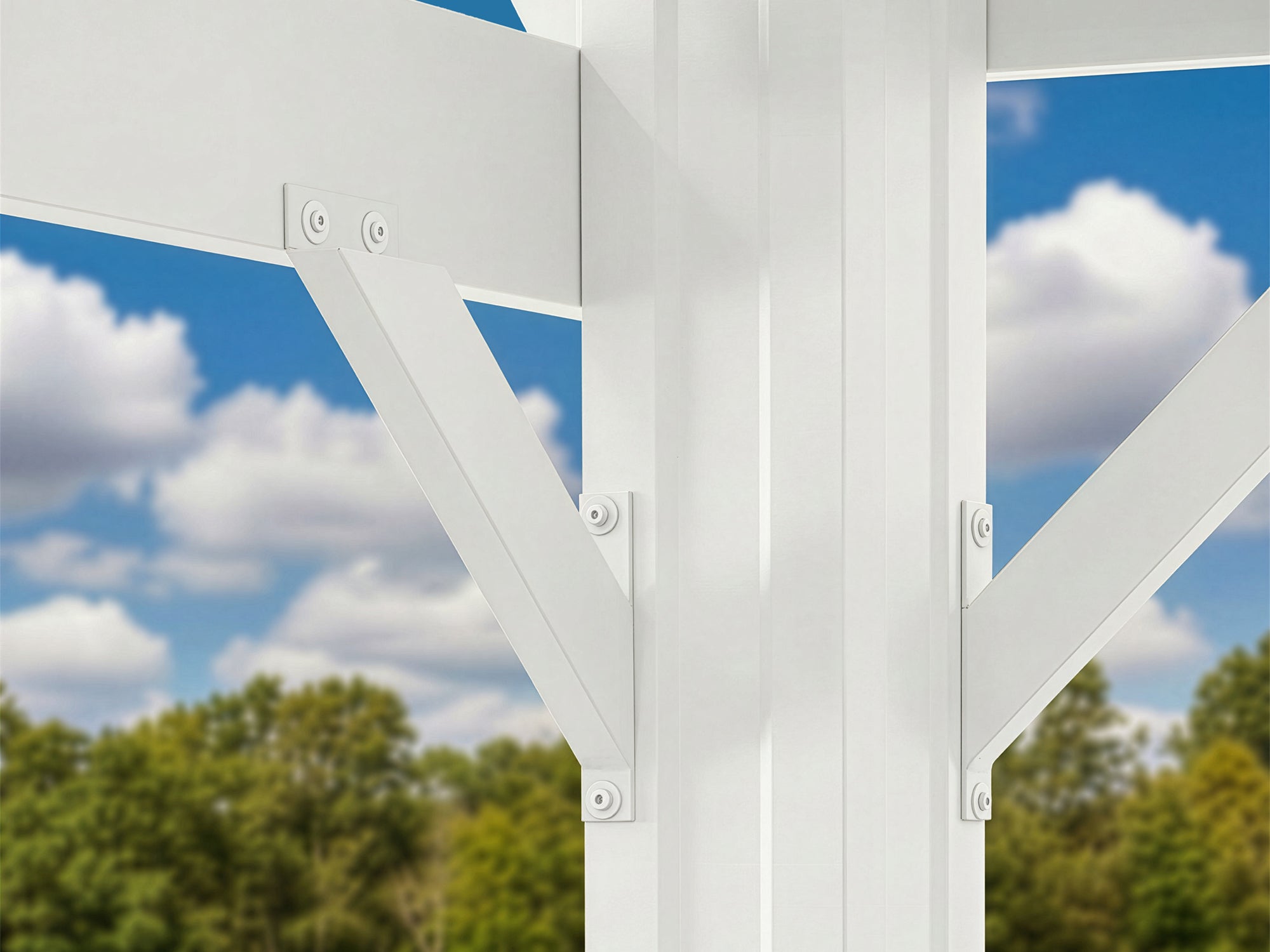 White powder-coated steel bracket securing trellis roof beam to Stratford pergola post against blue sky with clouds.