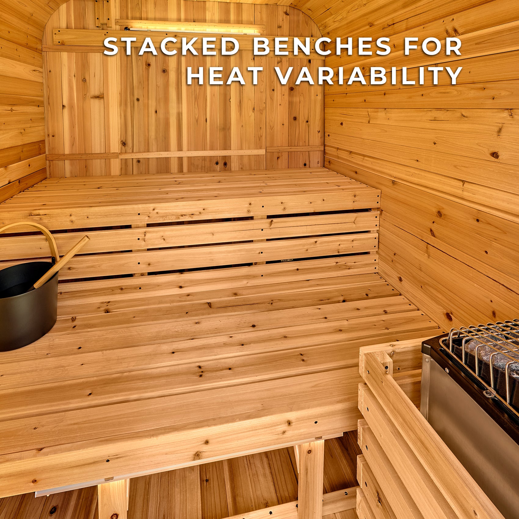 Interior of Lennon 4-6 person outdoor traditional cube sauna showing stacked cedar benches and electric heater