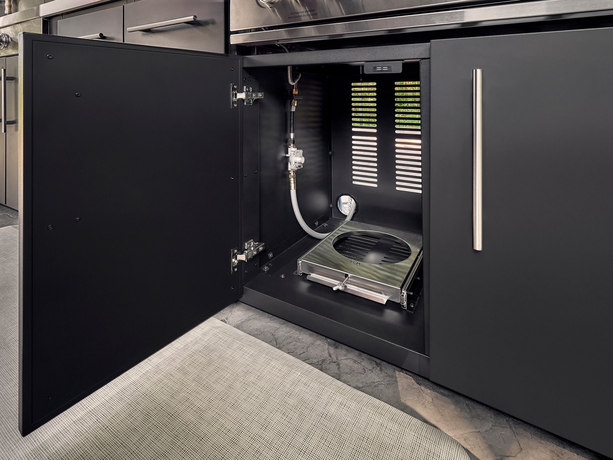 Inside of powder coated galvanized steel propane storage cabinet in Lancaster outdoor kitchen.