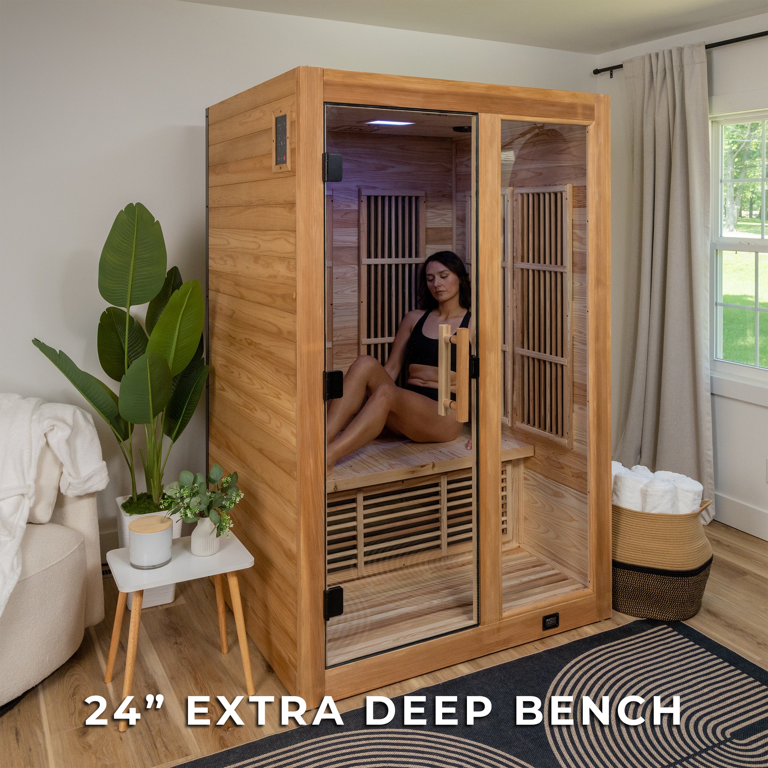 Woman relaxing inside Rylan indoor infrared cedar sauna in a modern home setting for daily wellness benefits