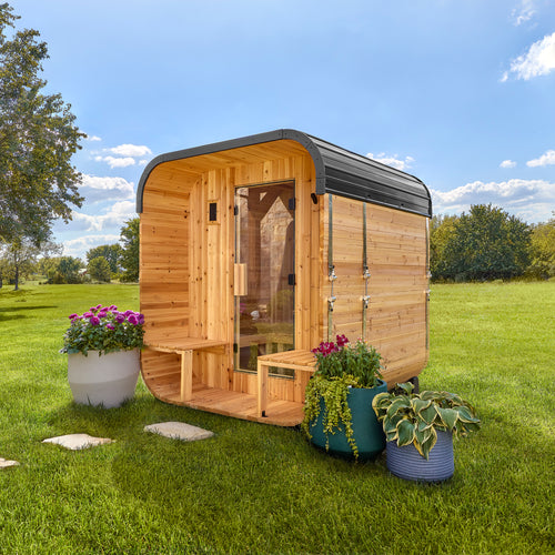 Backyard Discovery Lennon 2-4 person outdoor cube cedar sauna with porch and steel roof in sunny yard