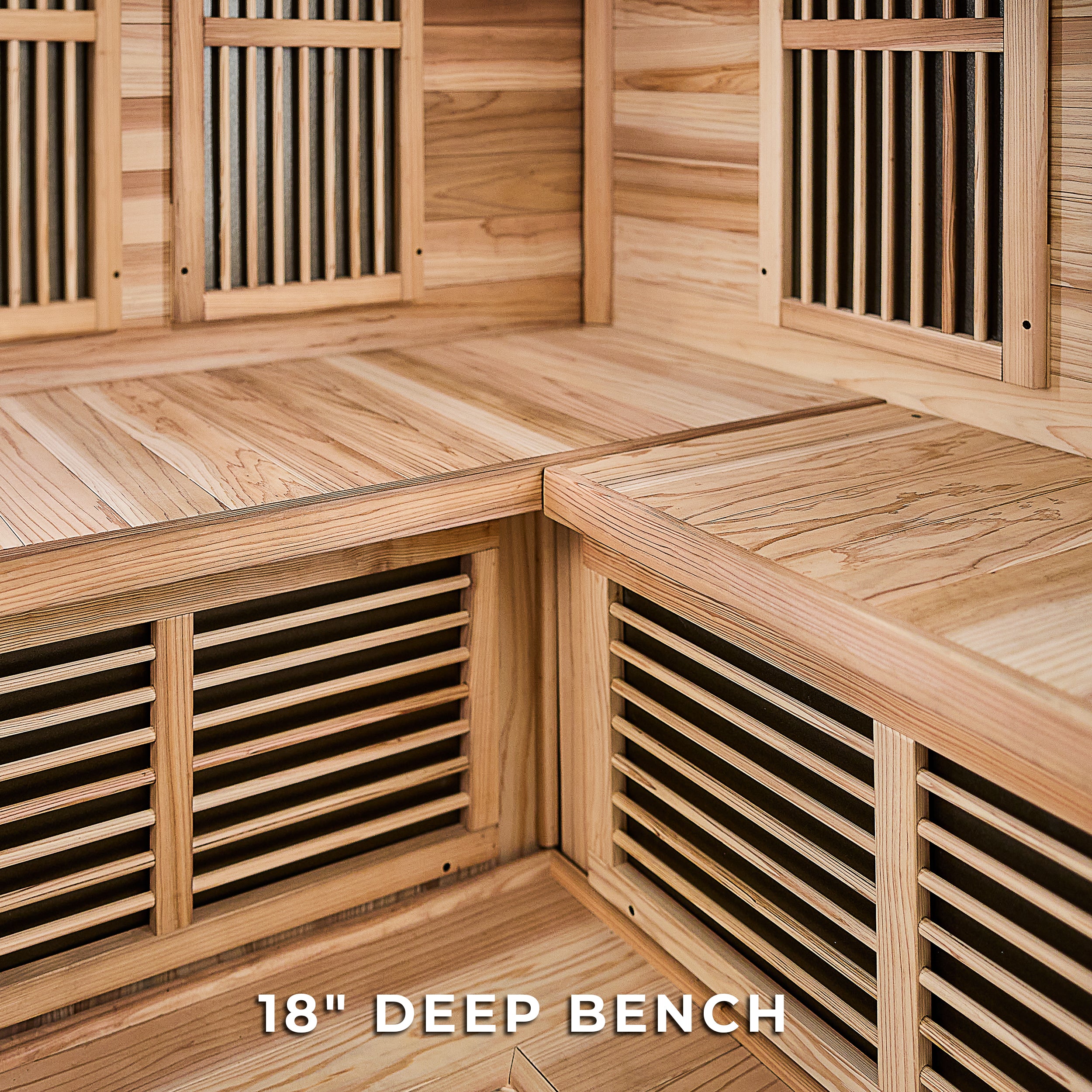 Cedar infrared corner sauna interior showing 18-inch deep L-shaped bench with infrared heater panels