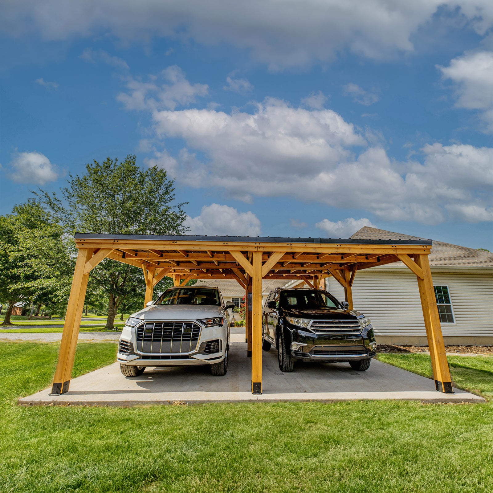 Load image into Gallery viewer, SUVs parked under wooden carport
