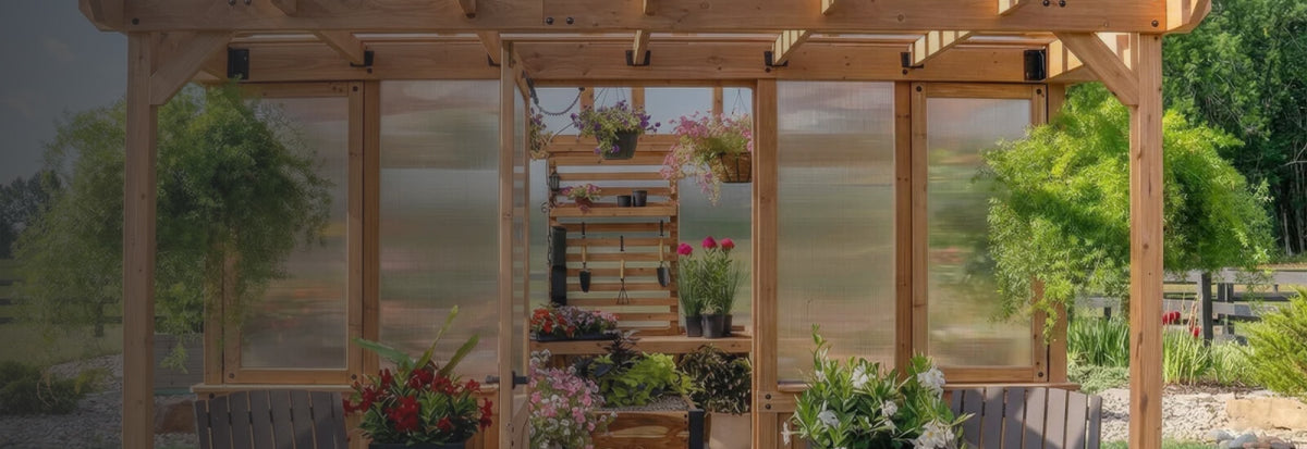 Looking into a cedar wooden greenhouse with a built-in pergola entrance and a slat wall with tools inside.