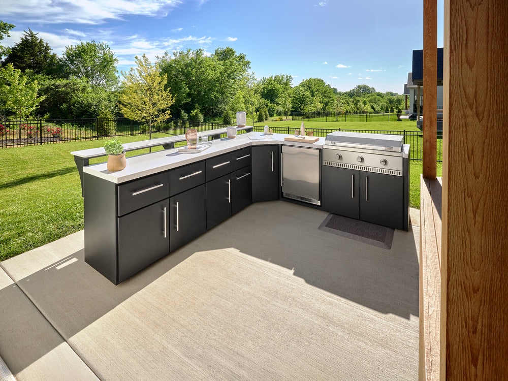 Emory outdoor kitchen with galvanized steel cabinets, engineered stone countertops, stainless steel flat top griddle.