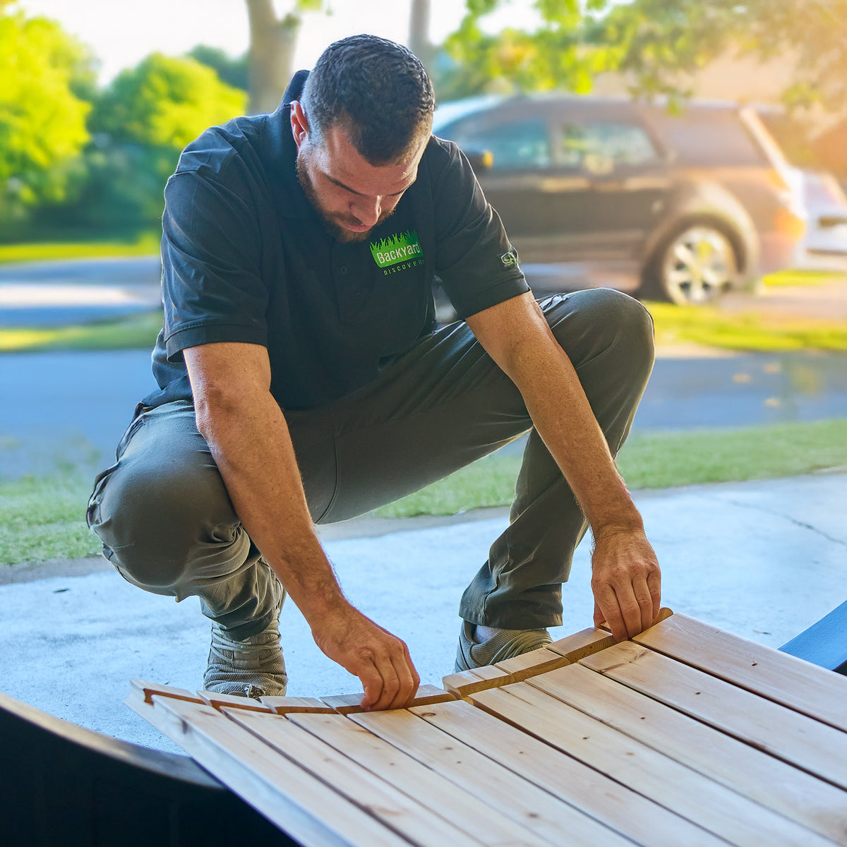 Backyard Discovery team member assembling Paxton traditional cedar sauna kit