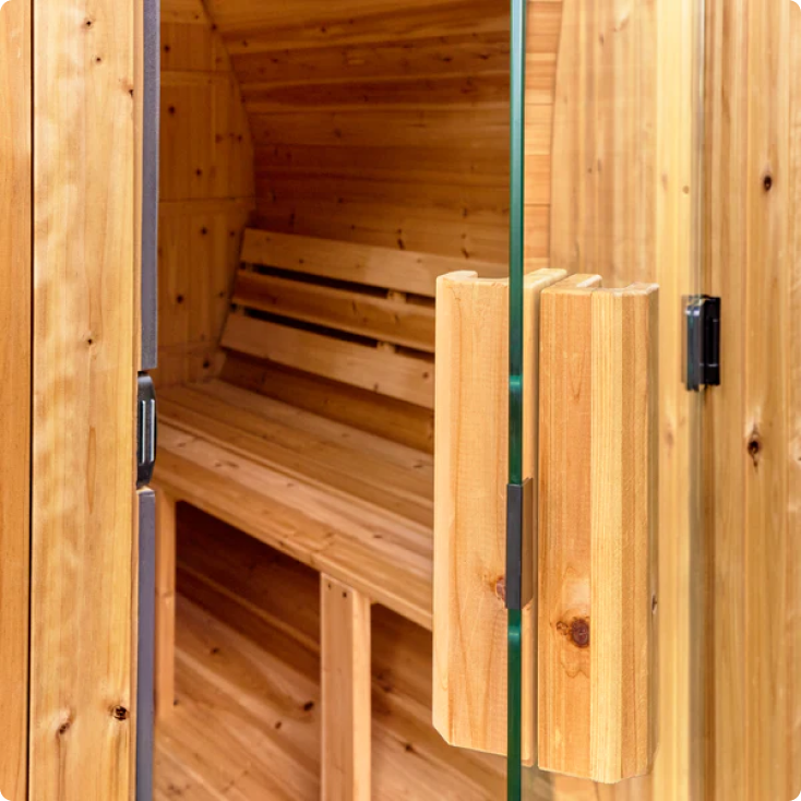 Wooden sauna with benches and open door
