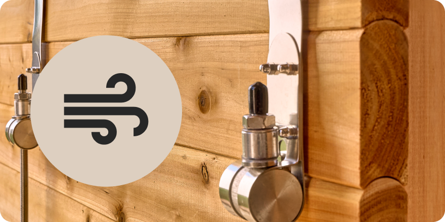 Close-up of a wooden barrel with metal taps and a logo on a white background