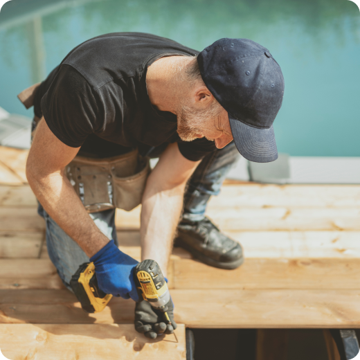 man drilling into wood