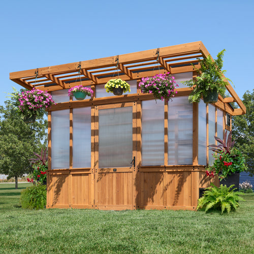 Backyard Discovery Poppy 11x7 greenhouse with a pergola overhang and hanging flower baskets.