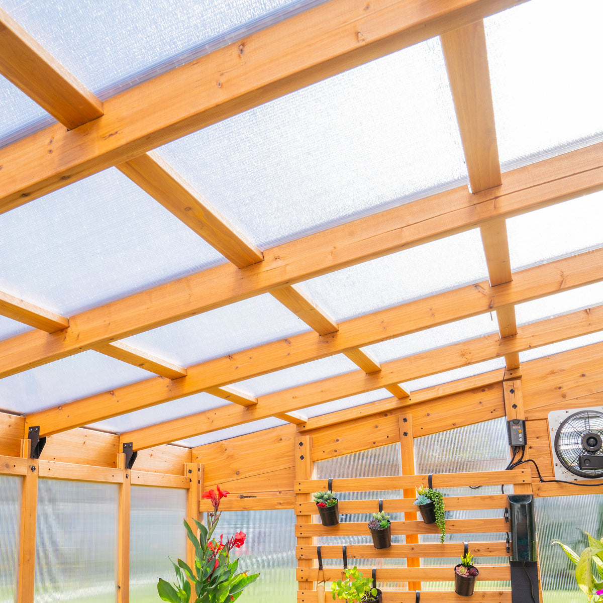 Cedar frame posts and rafters supporting the 4-wall polycarbonate roof panels of the 12x7 Zalie greenhouse.
