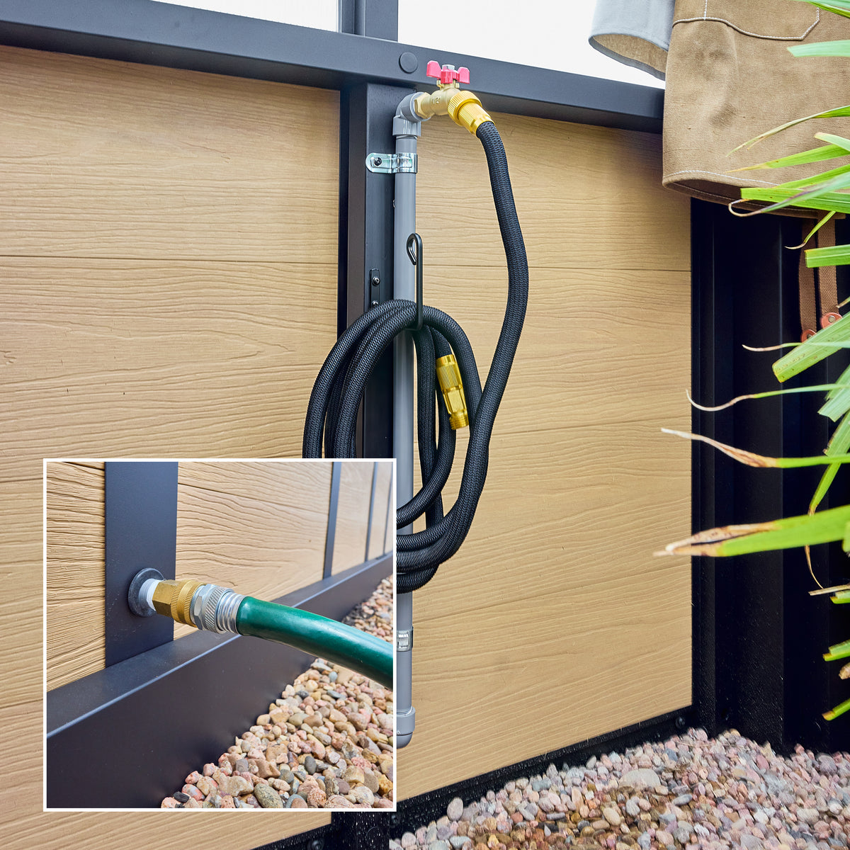 Exterior hose inlet and interior brass water spigot built into the base of a year-round powder-coated steel greenhouse.