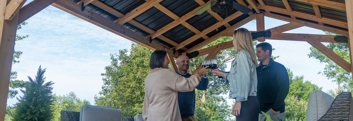 Friends celebrating under Peak Roof Gazebo