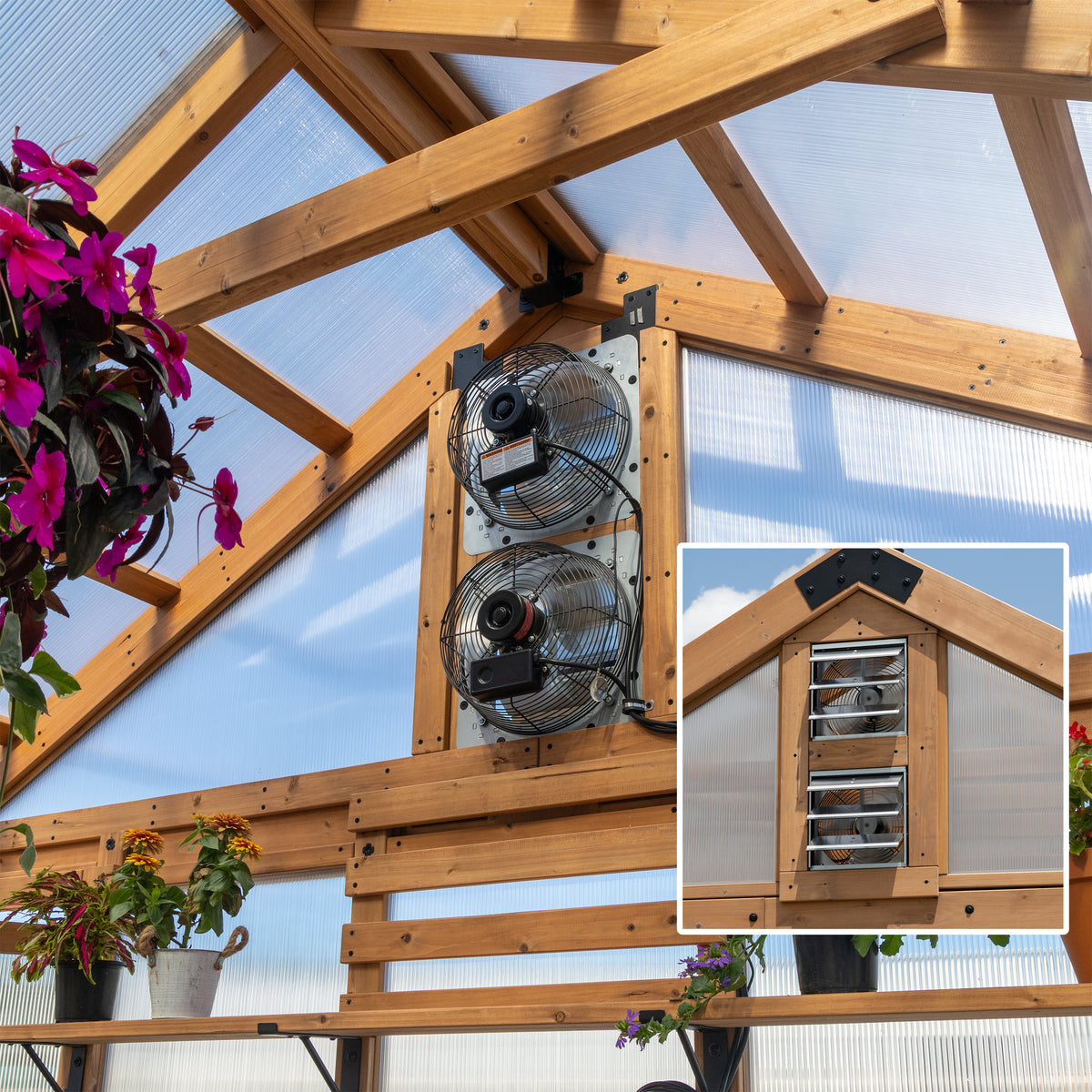 Thermostat exhaust fan unit mounted inside a cedar greenhouse with 4-wall polycarbonate panels and peaked roof.