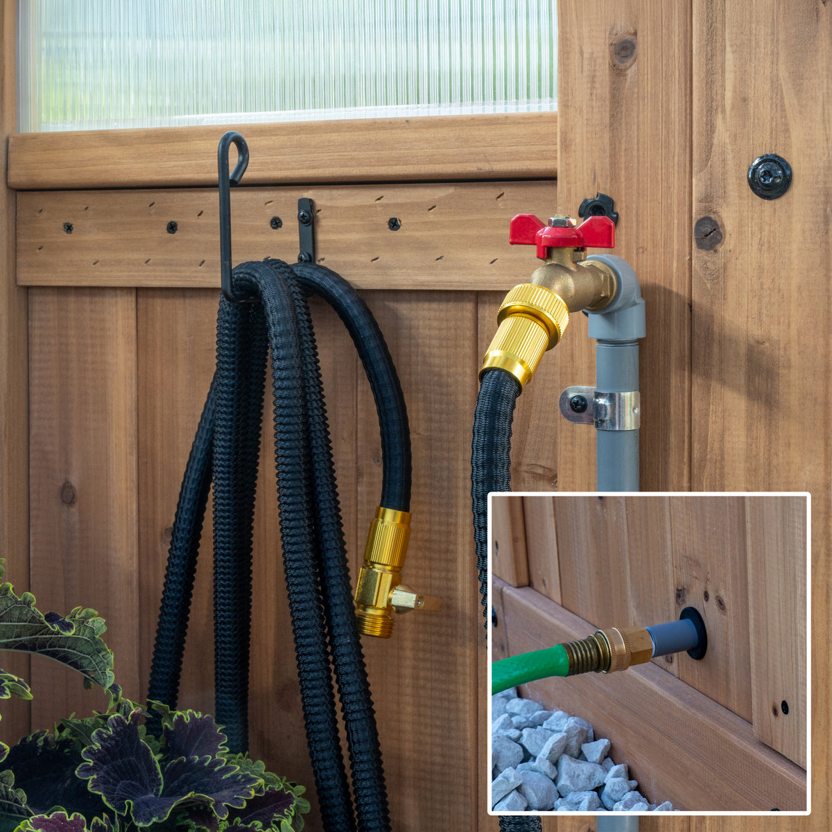 Exterior hose inlet and interior brass water spigot built into the base of a DIY cedar greenhouse.