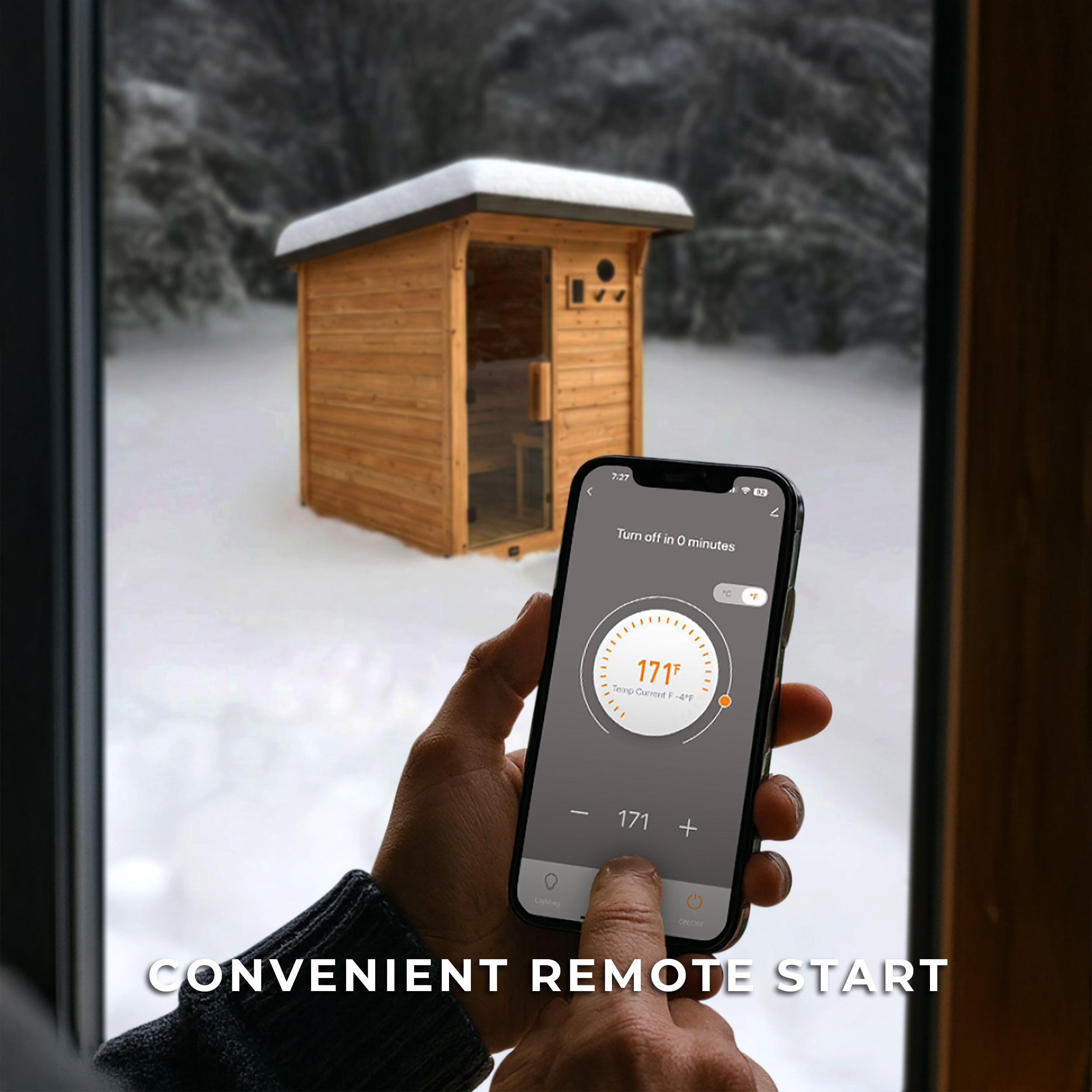Smart outdoor home sauna controlled by phone app showing 171°F with snow-covered Henley cabin in background