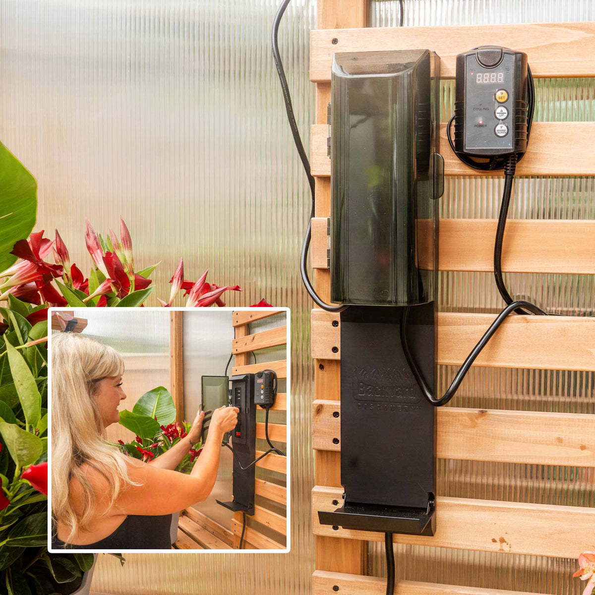 PowerPort hub and thermostat exhaust fan mounted on a cedar slat wall inside the 9x6 Poppy greenhouse.
