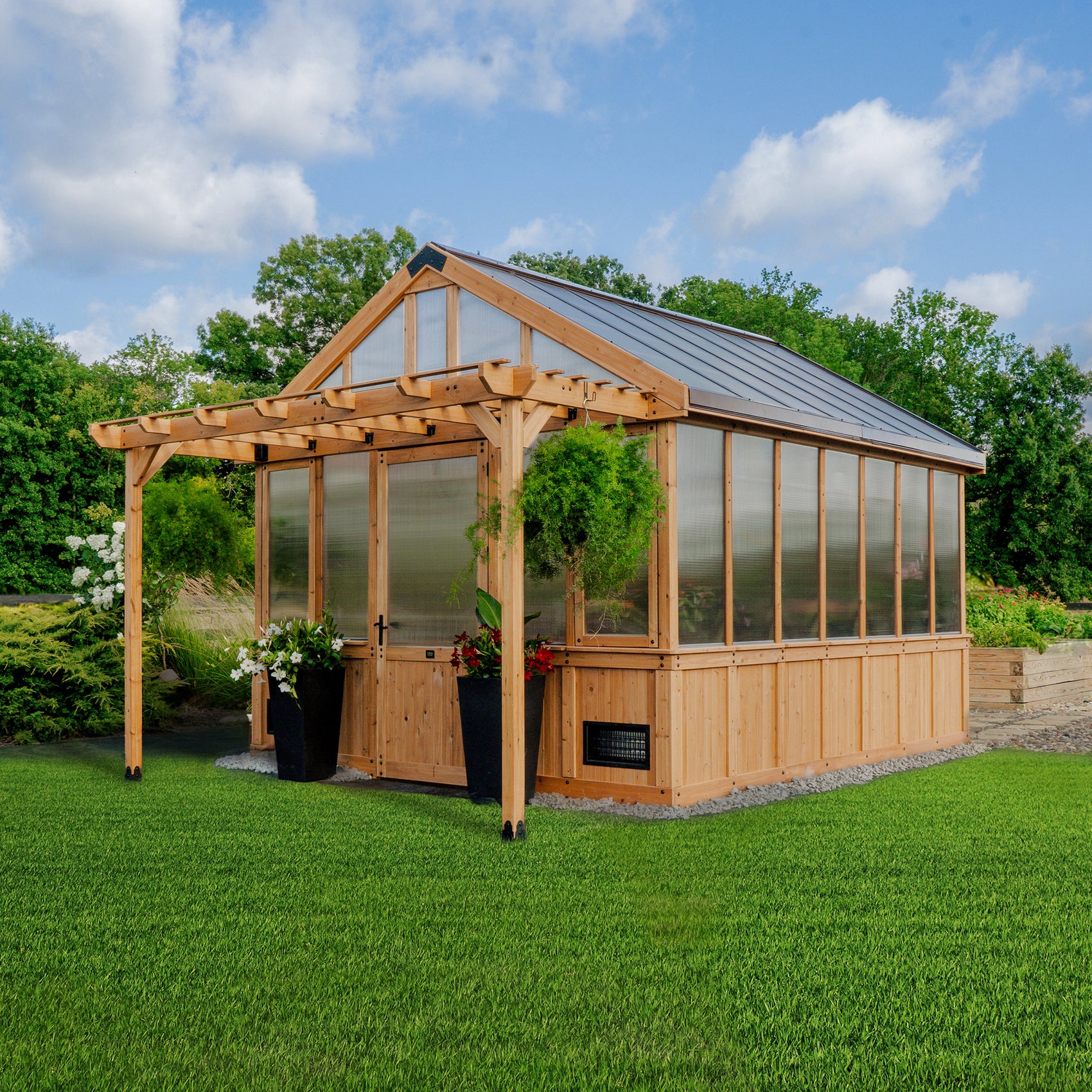 Backyard Discovery Bellerose XL 13x11 greenhouse with a peaked roof, pergola overhang, and wide entry door.