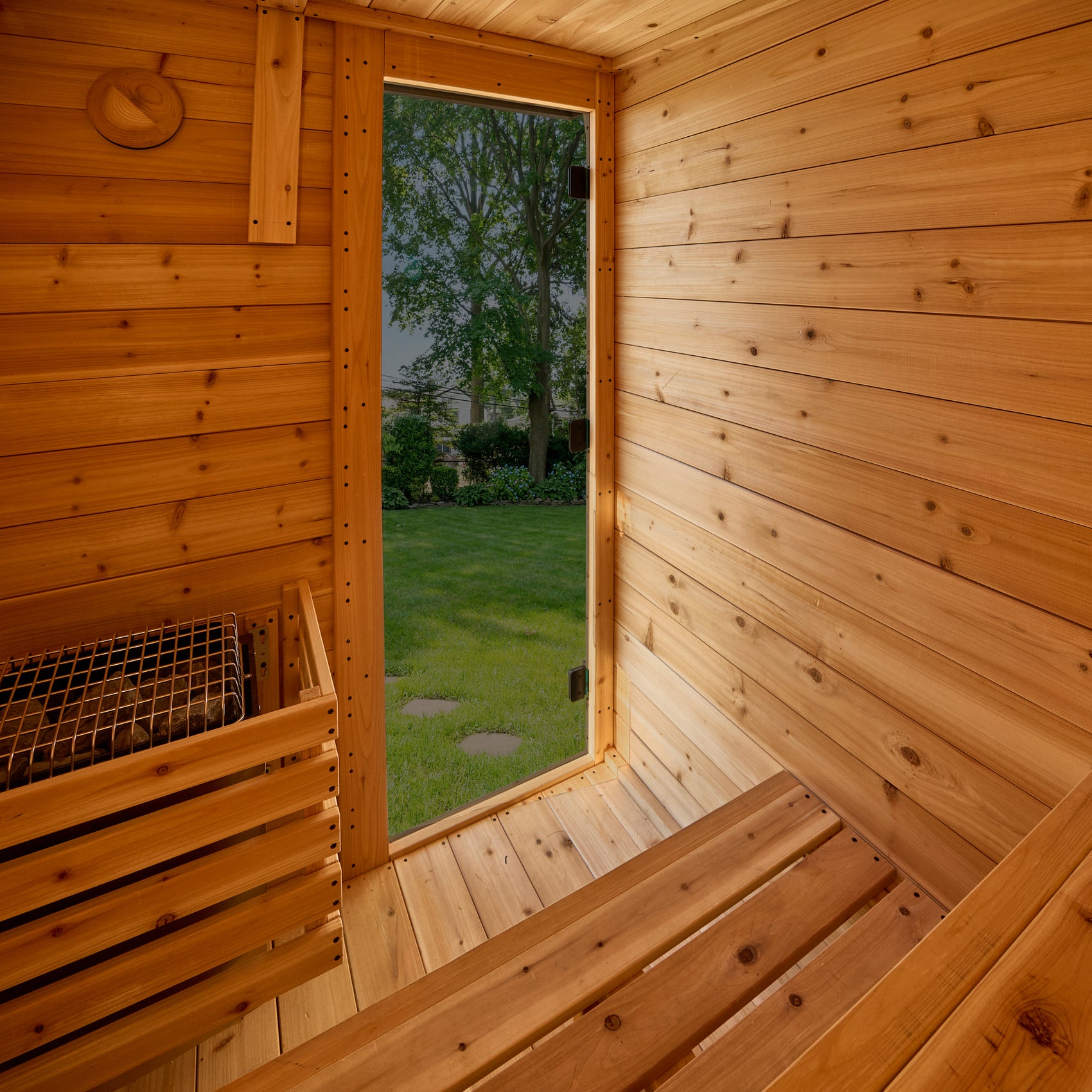 Bennett outdoor cabin sauna interior with cedar benches and ambient lighting