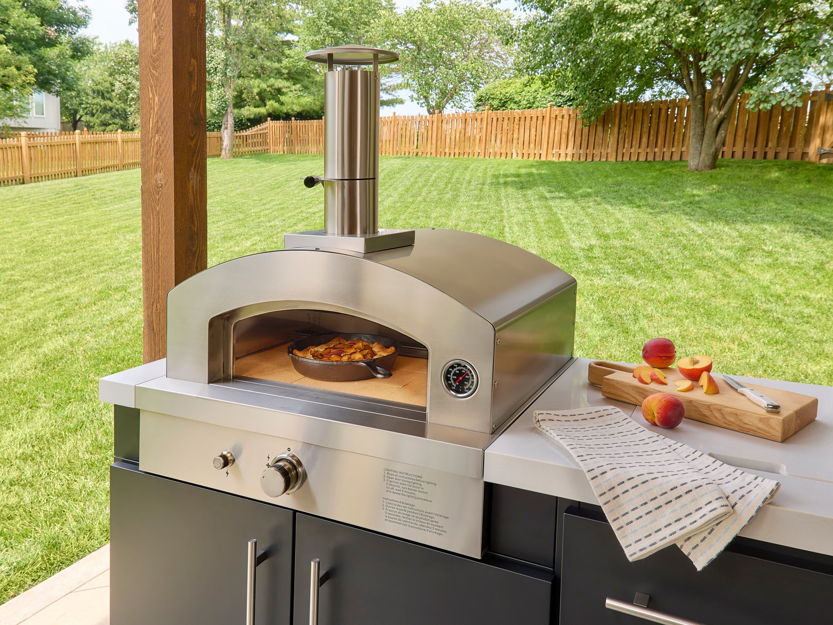 Cobbler baking inside a outdoor pizza oven in the Emory 12-foot integrated kitchen system.