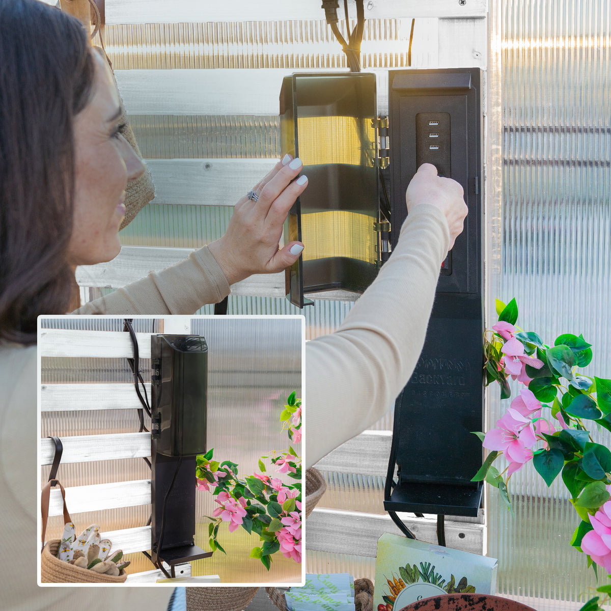Woman opening the PowerPort hub cover inside a white-frame greenhouse with pink flowering plants nearby.