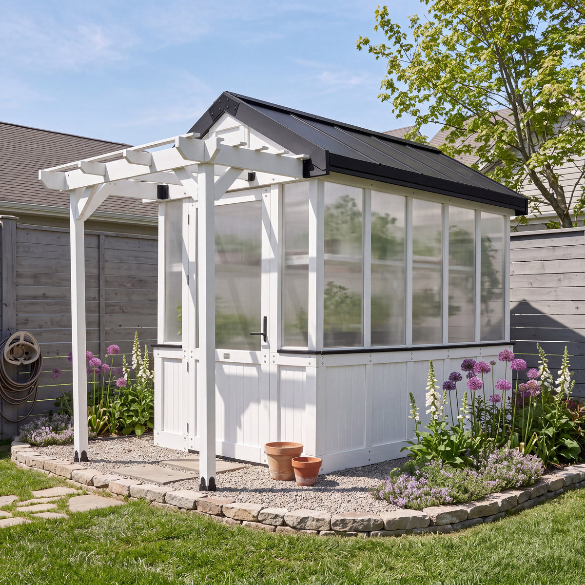 Backyard Discovery White Bellerose 9x6 greenhouse with a peaked roof, pergola overhang, and wide entry door.