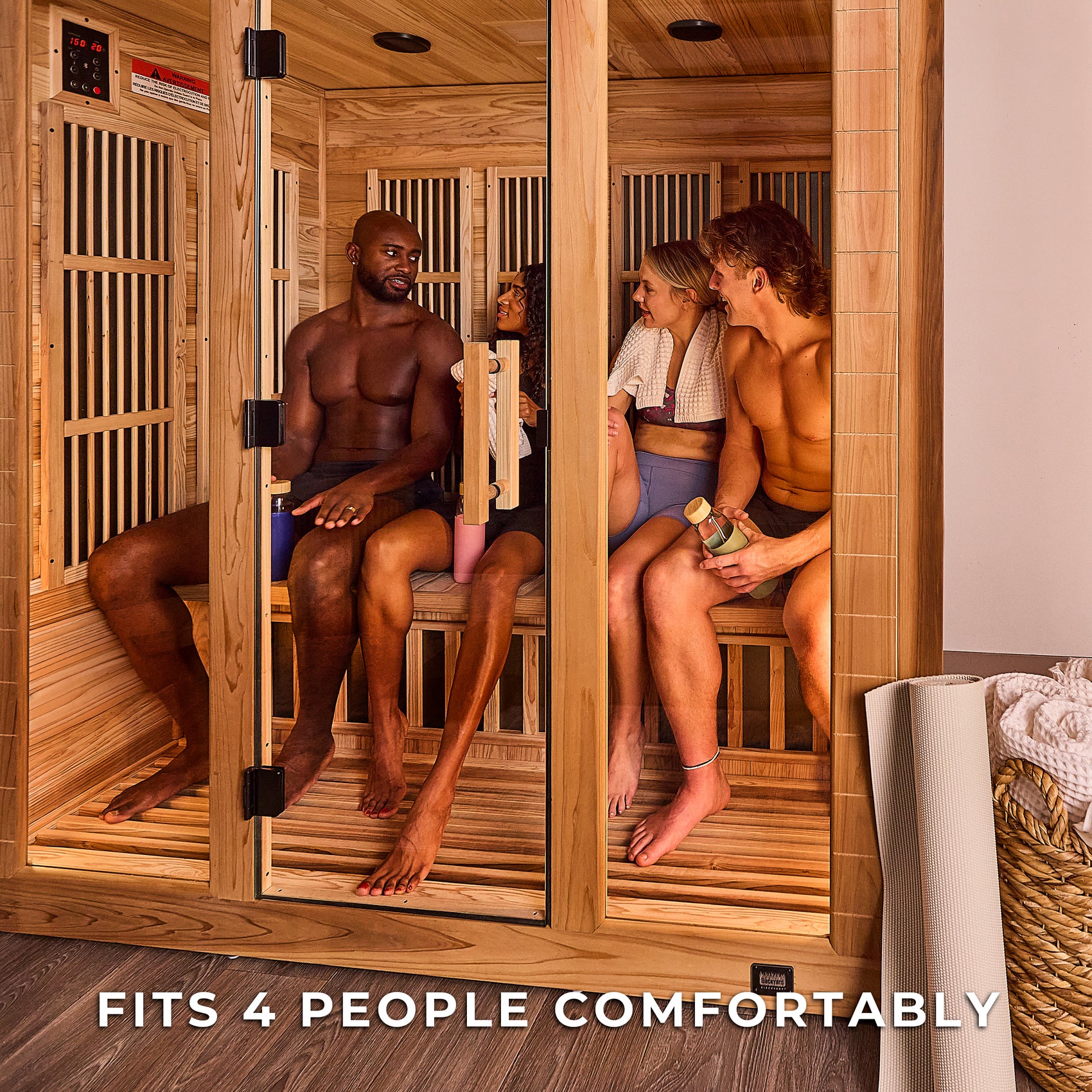 Four people socializing inside spacious Rylan 4 person indoor infrared home sauna enjoying wellness benefits