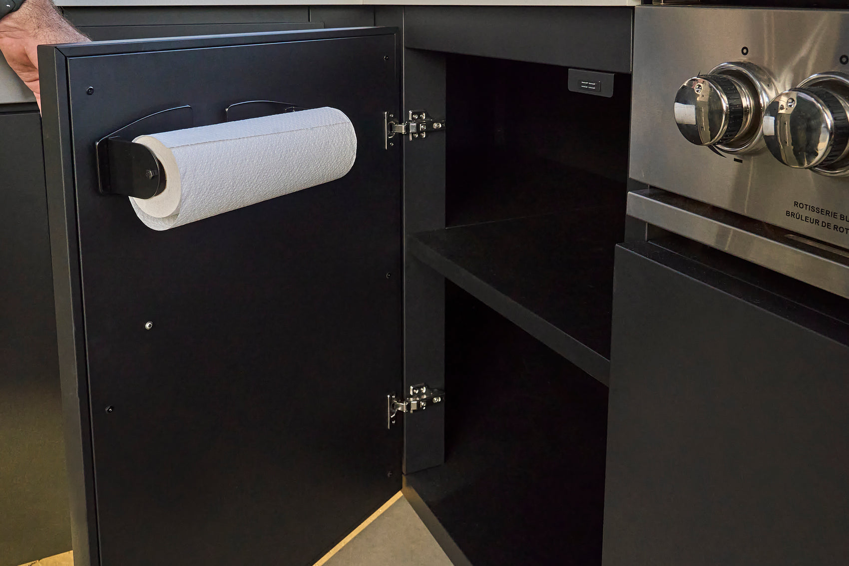 Magnetic paper towel holder inside galvanized steel outdoor kitchen cabinets door on Edgemont Bay kitchen.