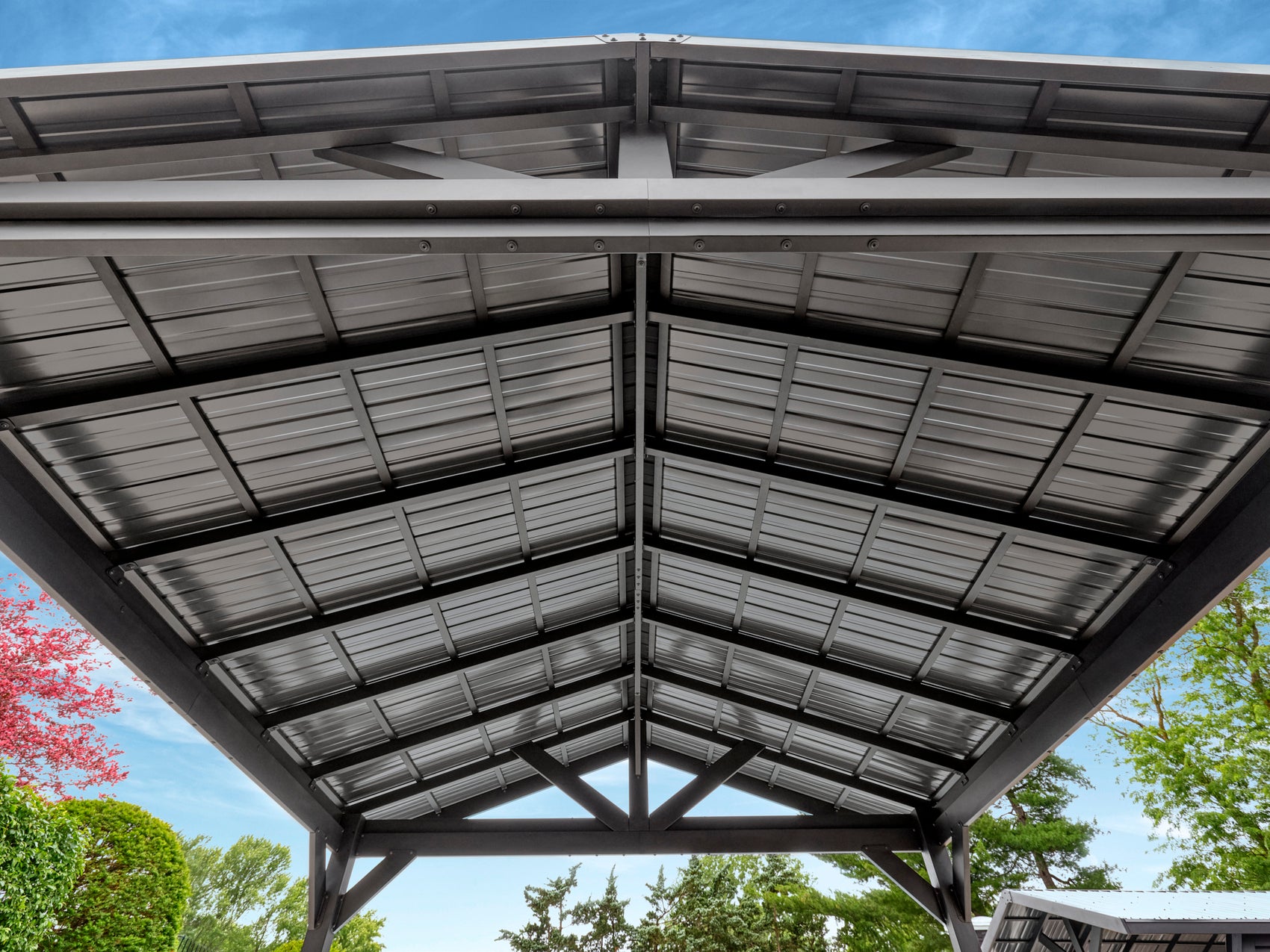 Range Outdoor Living Lancaster steel gazebo with dark metal roof panels and modern frame design.
