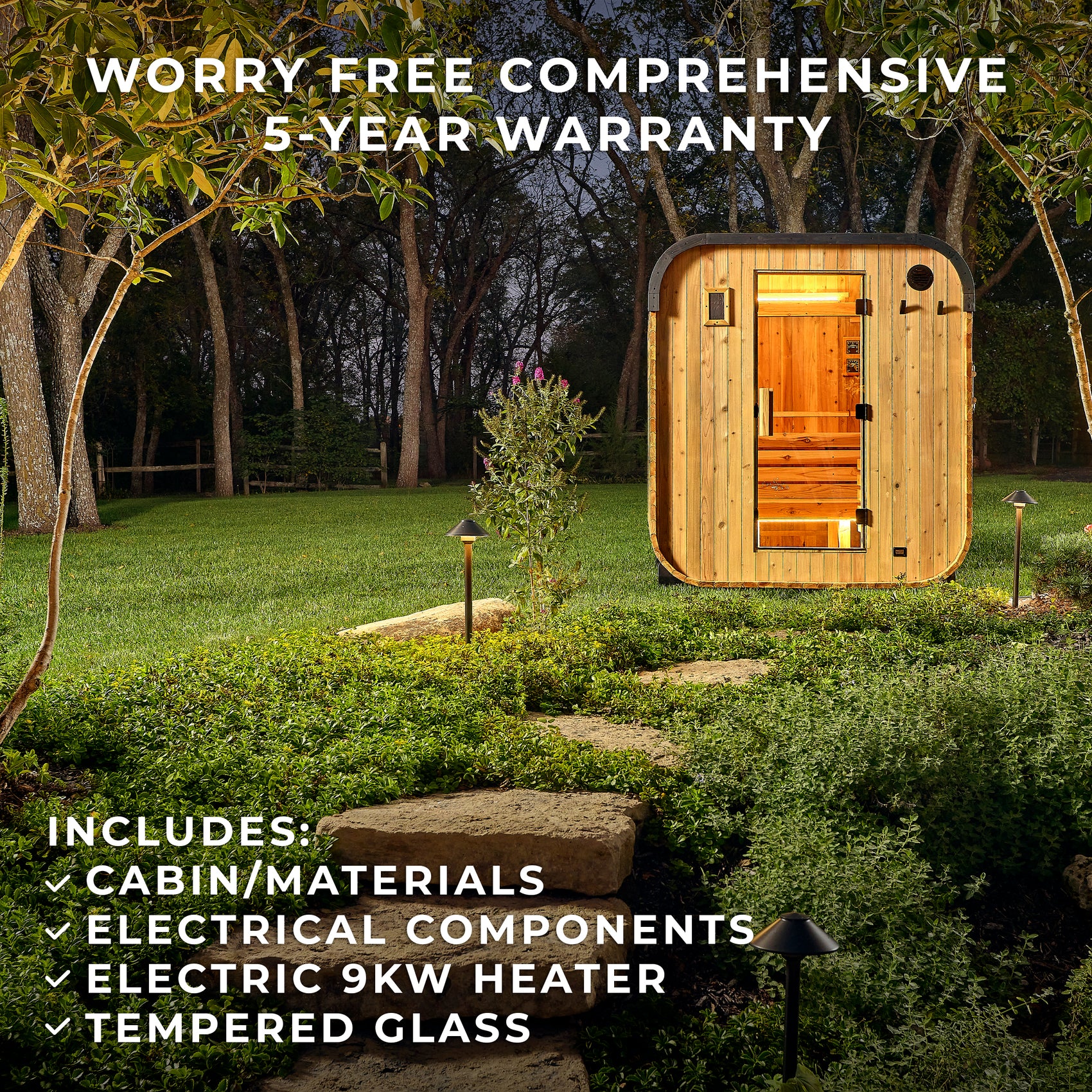 Backyard Discovery outdoor sauna glowing at night on landscaped lawn with stone path and garden lighting