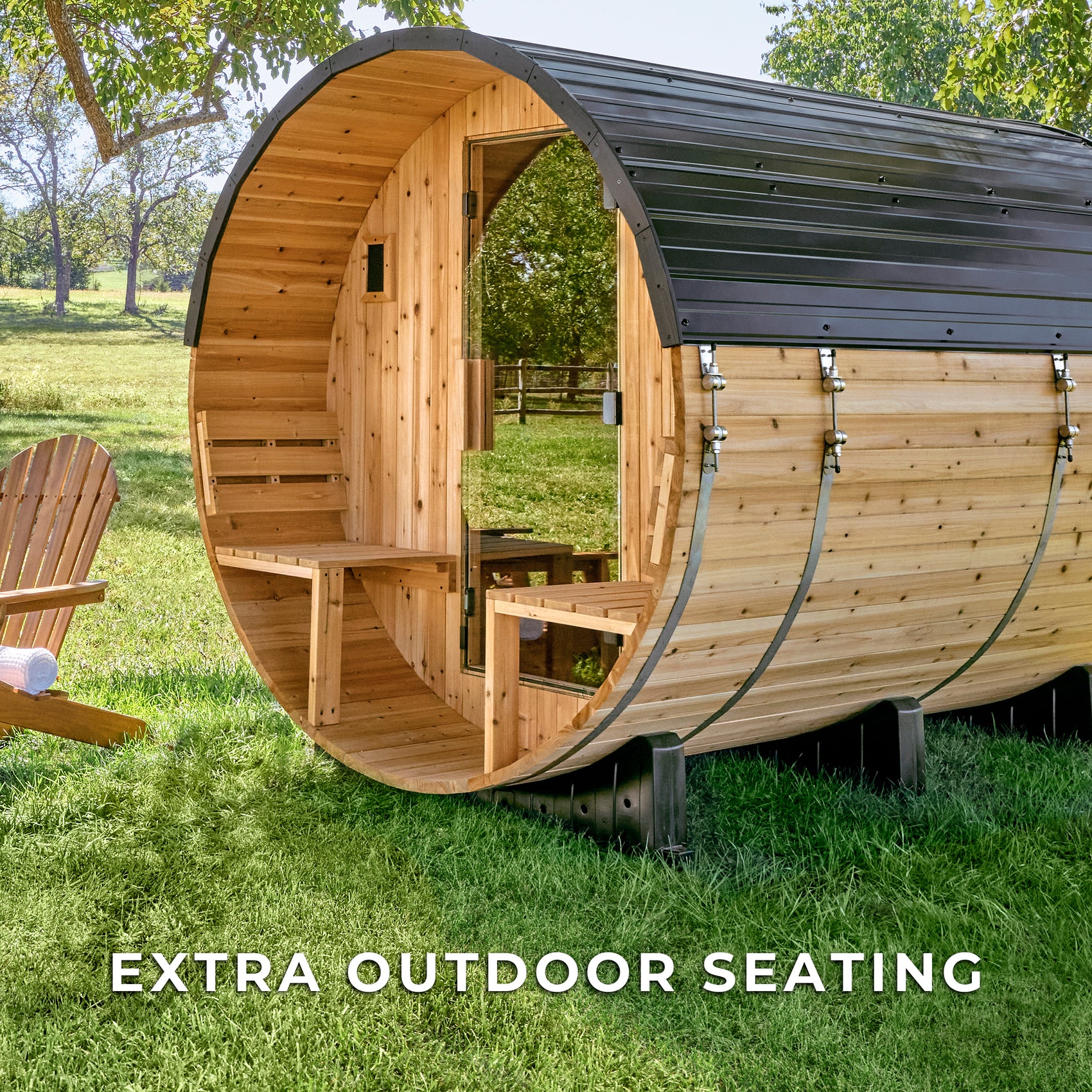 Backyard Discovery Paxton 4-6 person cedar barrel sauna with front porch and benches in sunny backyard