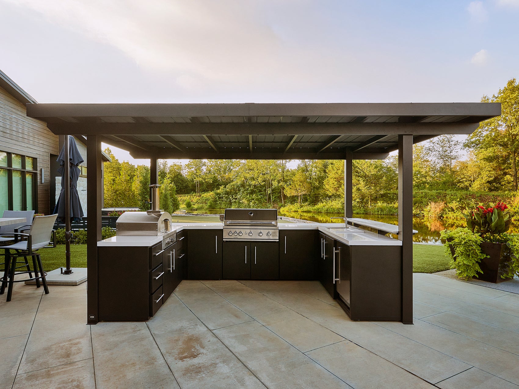 Edgemont Bay outdoor kitchen with premium appliances built in, under galvanized steel roof.