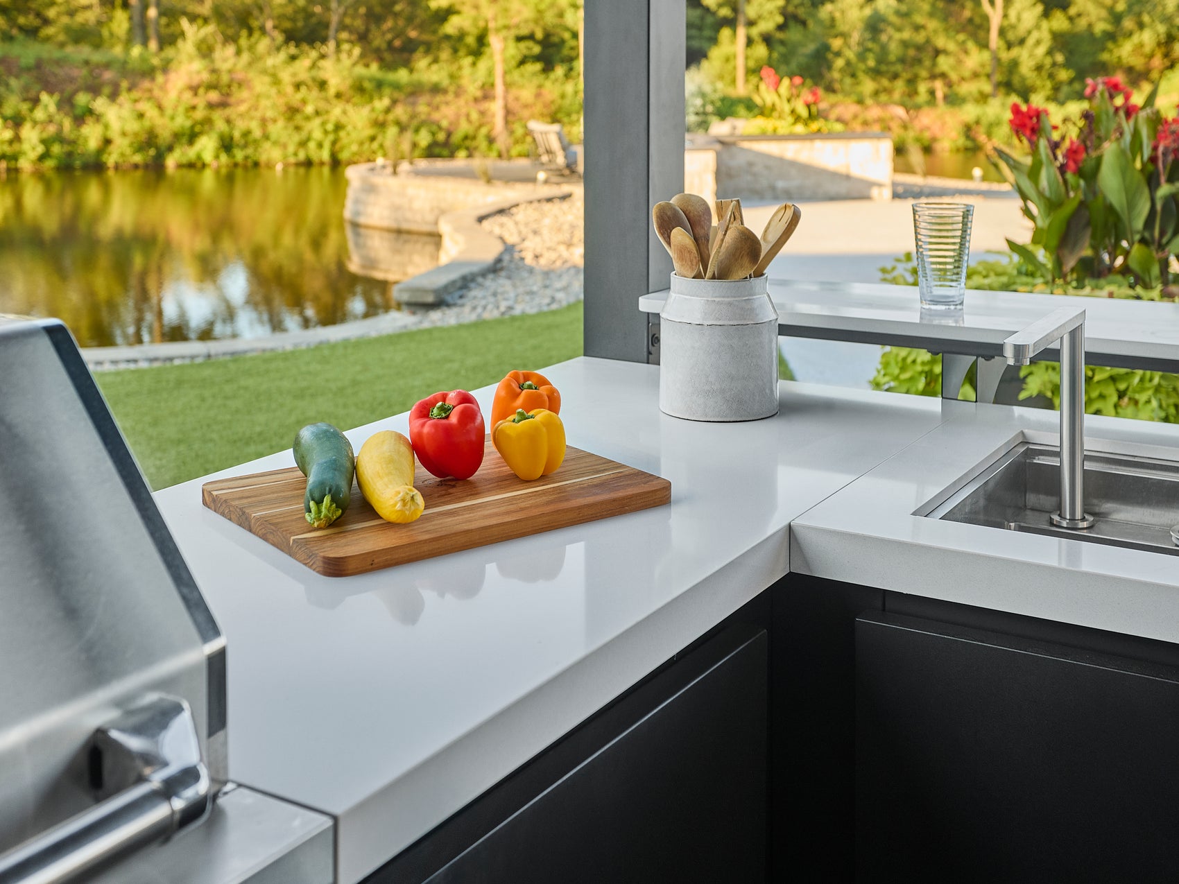Edgemont Bay outdoor kitchen countertop with cutting board and built-in stowaway sink.