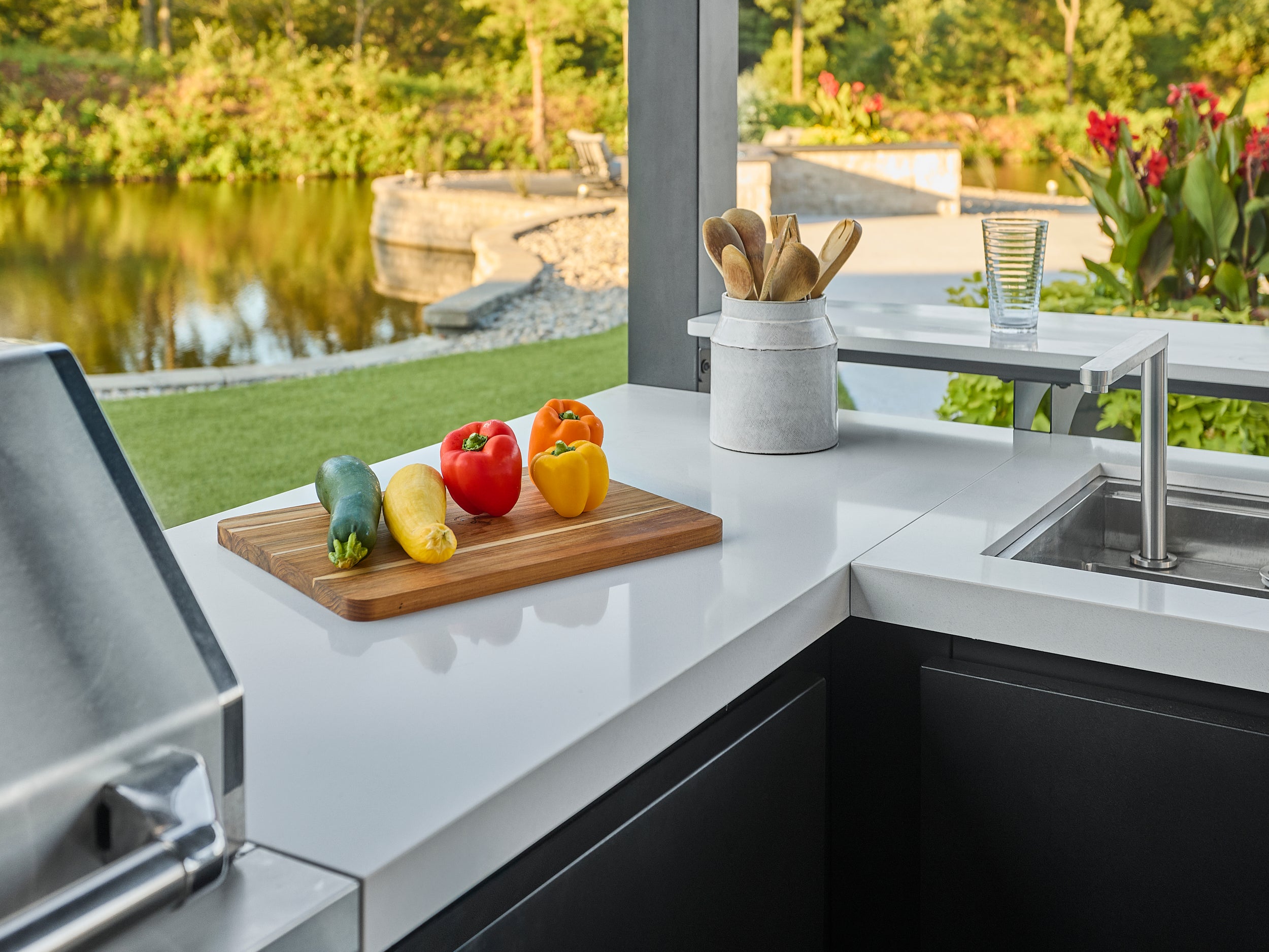Edgemont Bay outdoor kitchen countertop with cutting board and built-in stowaway sink.