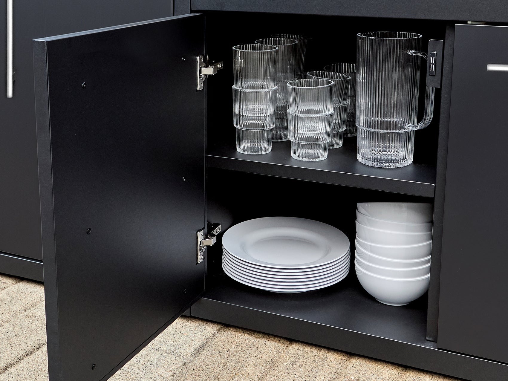 Soft-close cabinet storage with adjustable shelving in powder-coated galvanized steel outdoor kitchen island.