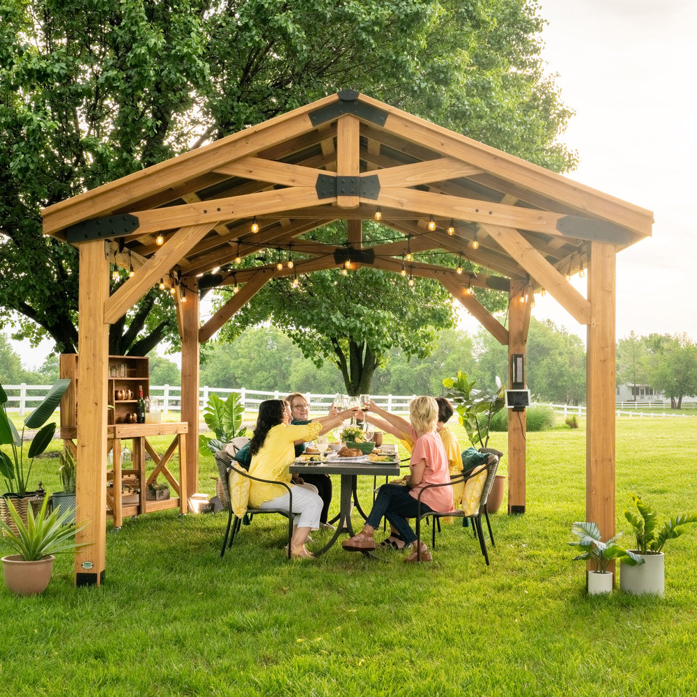 Load image into Gallery viewer, 14x12 Norwood Gazebo complements outdoor dinner party
