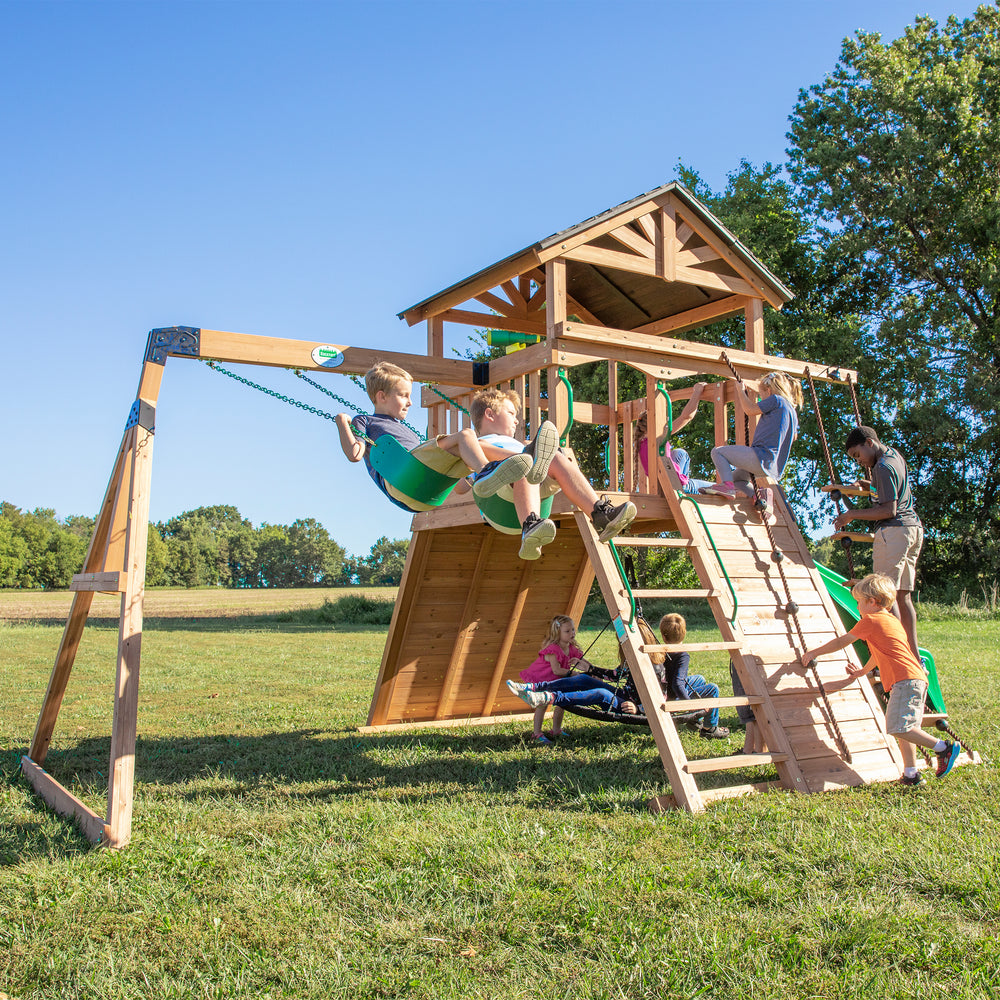 Children playing on wooden swing set